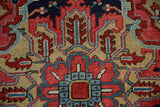 Heriz carpet's hand-knotted pile with cherry red, dusty teal, and pale gold stylized floral motifs.