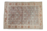 Vintage Sparta carpet with a slate blue-green field, scattered floral motifs, and a wide ivory border.