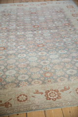 A low perspective on the vintage Sparta carpet's floral field and ivory-toned main border.