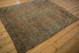 Distressed vintage Kamseh rug, side selvage with geometric patterns in oxidized silver and chestnut.