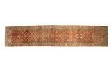 Vintage distressed Persian Heriz runner with an allover Herati motif in abrashed rust and terracotta tones.