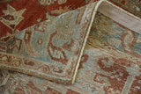 Folded corner of a vintage Heriz runner shows the hand-knotted back and secured side cord.