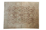 Vintage distressed Sivas carpet with a paneled trellis design of stylized animal figures in pale coffee brown and dusty seafoam green.