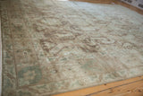 Low angle on a distressed Sivas carpet highlights its soft, even wear and faded tones.