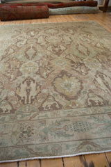 Angled view across the distressed Turkish Sivas carpet's muted, paneled design and soft texture.