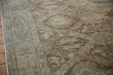 Detailed view of a vintage Sivas carpet's trellis border and paneled design motifs in muted earth tones.