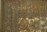 Intricate corner border of a vintage Ardebil carpet with stylized guls in sky blue, sand, and ivory.