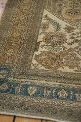 Intricate sky blue and sand-colored borders on a hand-knotted vintage Ardebil carpet.
