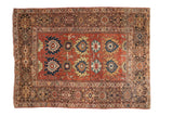 Antique hand-knotted Persian Mahal fragment, circa 1910s, madder red field, oversized palmettes, and animal motifs.