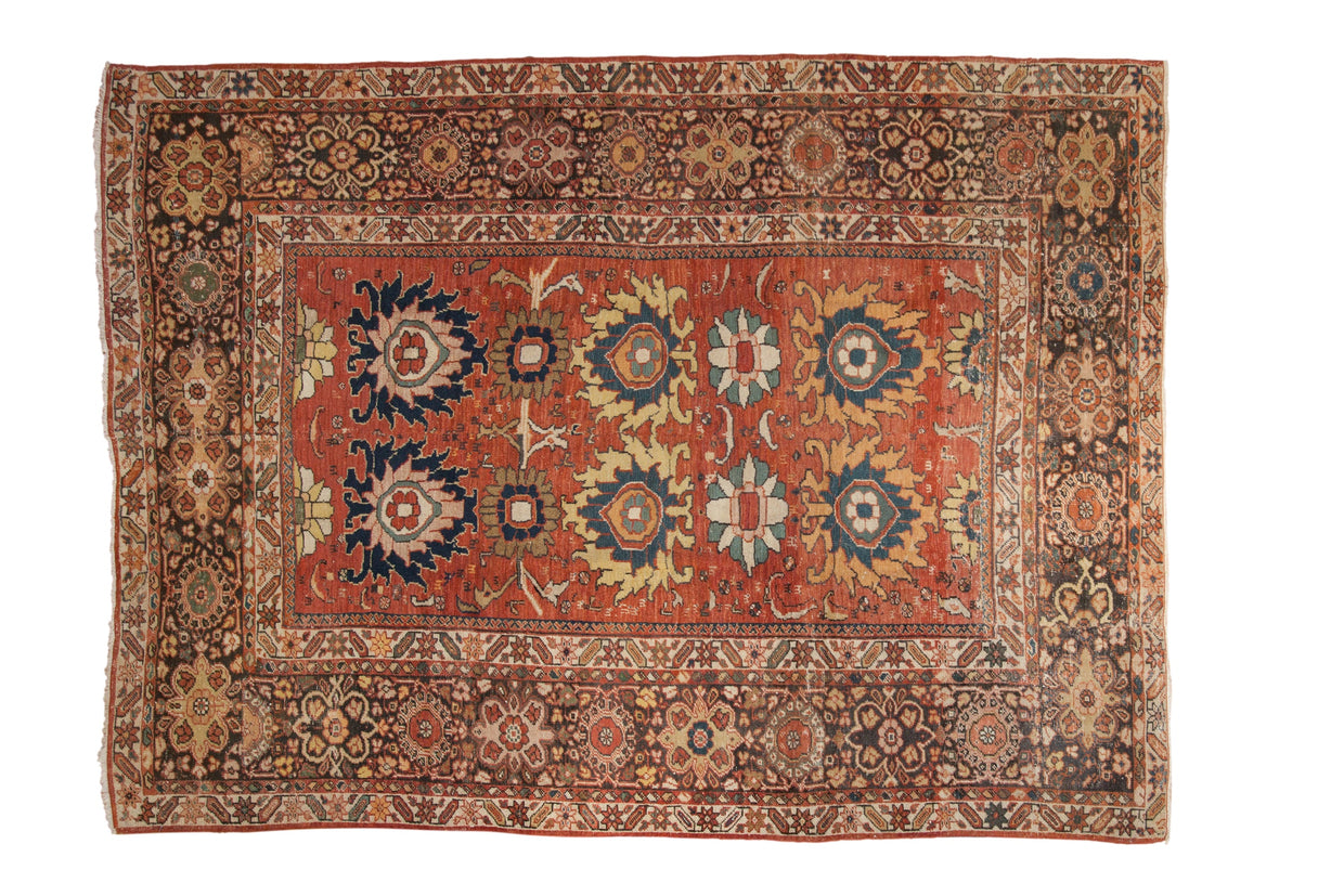 Antique hand-knotted Persian Mahal fragment, circa 1910s, madder red field, oversized palmettes, and animal motifs.