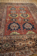 Antique Mahal carpet corner: madder red field, navy palmettes, primitive arabesques, multi-color borders.