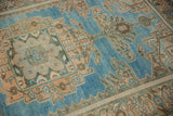 Low pile texture showing even wear on a Hamadan rug's sky blue and peach design.