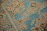 Even wear across the low, hand-knotted pile of a distressed vintage Hamadan rug.