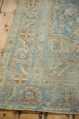 Distressed vintage Afshar rug's soft pile, revealing sky blue and pale coffee floral palmettes.