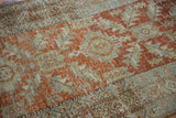 Detailed view of wear to the foundation and knot heads on a vintage distressed Heriz rug runner.