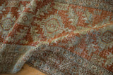 Close view of the hand-knotted texture and storied wear on a vintage Persian Heriz runner.