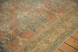 Roundel palmette border detail on a vintage Caucasian carpet with a soft, distressed patina.