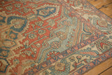 Close-up on the even wear and texture of a distressed Bakhtiari rug's hand-knotted pile.