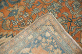 Corner detail of an antique Farahan Sarouk showing the terracotta pile and hand-knotted back.