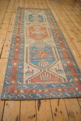 Angled perspective showing the full length of the antique Serab runner's geometric design.