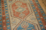 Evenly worn, hand-knotted pile of an antique Serab rug with camel and geometric motifs.
