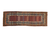Antique Karabagh runner with a field of staggered red boteh motifs surrounded by multiple tiered borders.