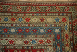 Corner of an antique Karabagh runner with tiered floral borders and rich, age-related patina.