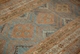Low pile texture of a distressed Malayer showing rust medallions on an abrashed sky blue ground.