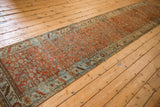 Distressed Bijar runner, Herati pattern with heavy abrashes in terracotta and dusty blue.