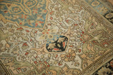Close-up of a distressed Sarouk rug showing even wear to the knot heads.