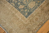 The worn, low pile and visible foundation on the corner of a distressed vintage Bijar carpet.