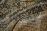 Detail showing the heavy abrash and worn pile of a distressed vintage Bijar carpet.