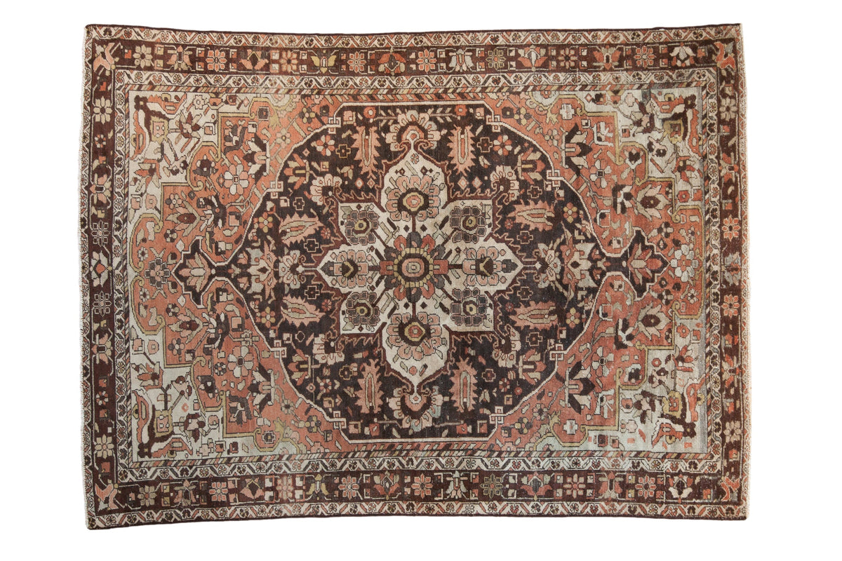 Vintage distressed Hamadan carpet with a sprawling charcoal medallion, a dusty copper rose field, and intricate palmettes.