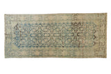 Distressed vintage Mahal runner, faded blue Herati diamond pattern, meandering vine borders.