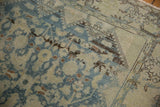 Distressed Mahal rug with low pile, faded Herati design, and visible foundation.