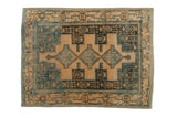 Distressed vintage Senneh rug with stepped medallions and Samovar border in dusty blue and cream.