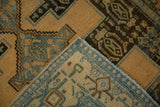 Hand-knotted back and wool pile texture of a distressed Persian Senneh rug's corner.