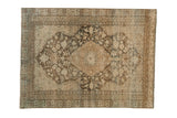 Vintage distressed Persian Mahal rug with a central starburst medallion in pale brown and sand.