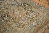 Angled detail of the distressed Mahal rug's starburst medallion and worn, low pile texture.