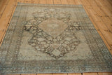 Angled perspective of a vintage Mahal rug highlighting its distressed, low-pile texture.
