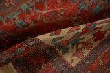 Low, hand-knotted pile and meandering blossom border of a folded antique Persian rug.