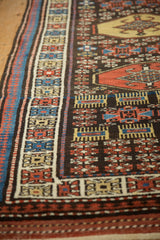 The intact side selvage next to geometric border motifs on a vintage hand-knotted Kurdish runner.