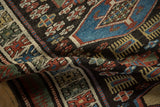 Close-up on the short, even pile and geometric guls of a vintage Kurdish runner.