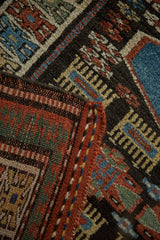 Close-up of the vintage Kurdish rug's original side cord selvage and handwoven back.
