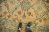 Worn low pile of a vintage Persian Malayer carpet in cream, dusty blue, and oxidized silver tones.