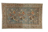 Vintage distressed Malayer rug with floral bouquets on a slate blue field and a serpent design border.