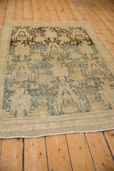 Angled view of a distressed Bijar rug showing its textured wear and dynamic dye lot change.