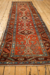 Perspective view down the length of an antique Northwest Persian runner with stepped medallions.