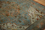 Distressed Malayer rug detail: geometric Herati motif, spandrel, worn pile in slate blue and ruby rose.