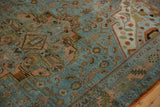 Malayer rug's distressed texture, geometric Herati field, and corner spandrel in blues and rust.